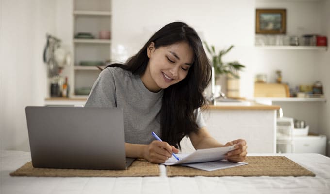 Woman checking a paper statement